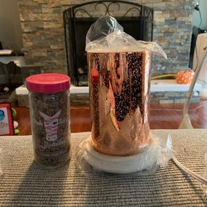 Pink zebra simmering light with vanilla barnwood scent